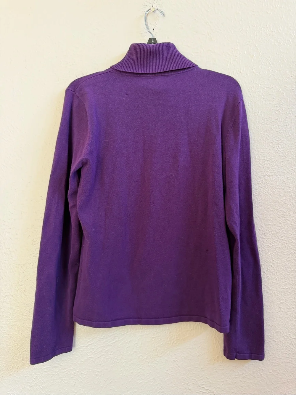 Harold’s purple turtleneck sweater